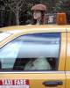 Liv and Milo hailing a cab in New York